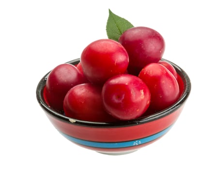 Damson plum in a bowl on white background photo