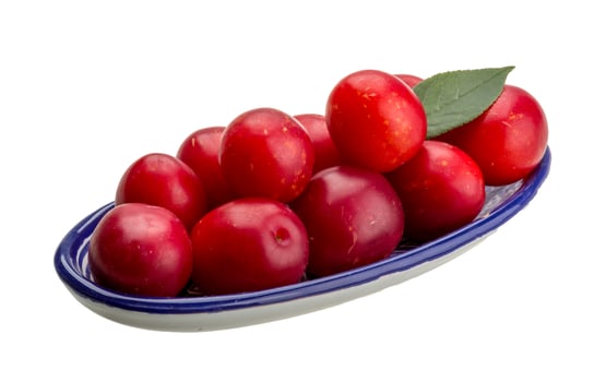 Damson plum in a bowl on white background photo