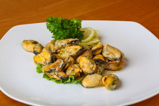 Mussels in butter sauce photo