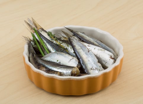 Salted anchovy on wood photo