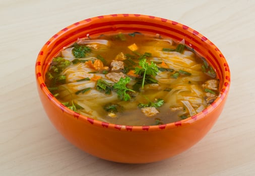 Soup Pho in a bowl on wooden background photo