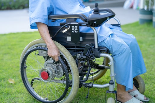 Asian senior or elderly old lady woman patient on electric wheelchair with remote control at nursing hospital ward, healthy strong medical concept photo