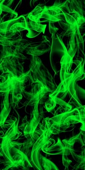 Abstract green smoke on black background photo