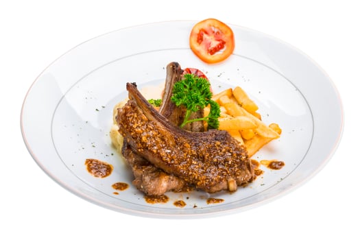Lamb chops on the plate and white background photo