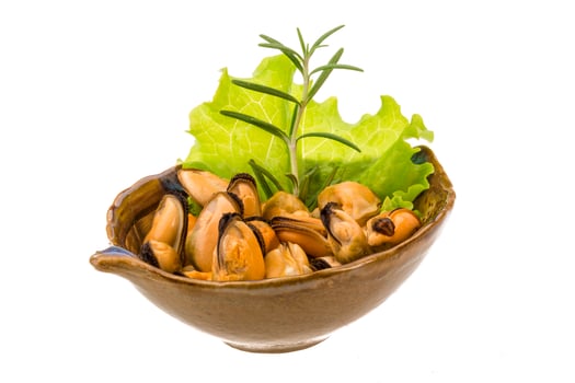 Marinated mussels in a bowl on white background photo