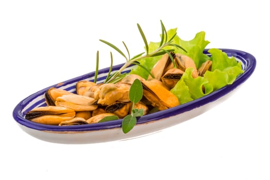 Marinated mussels in a bowl on white background photo