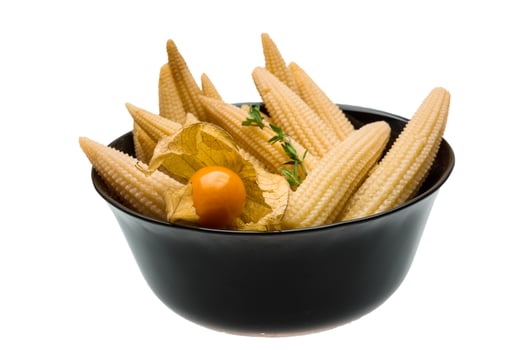 Baby corn in a bowl on white background photo