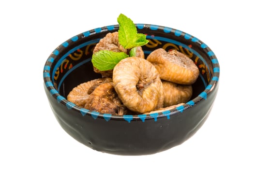 Fig in a bowl on white background photo