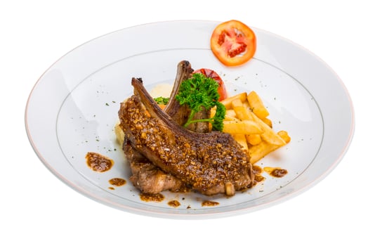 Lamb chops on white photo