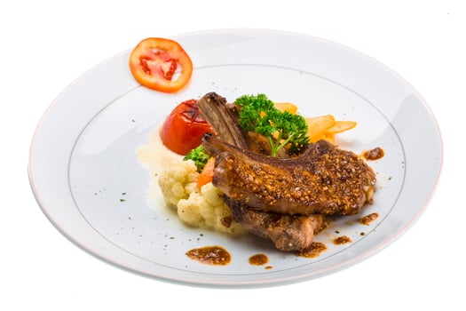 Lamb chops on white photo