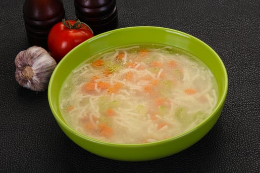 Chicken soup with noodles photo