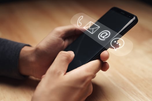 Customer support hotline Contact us people connection. Businessman using smartphone with the email, call phone, address, Chat message icons. photo