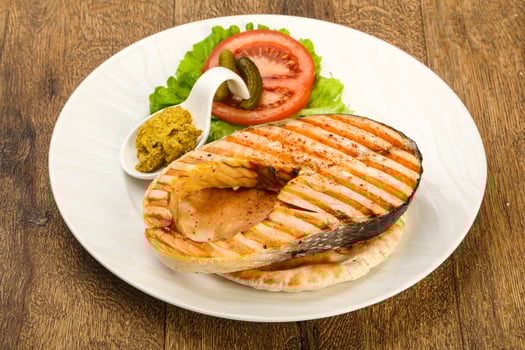 Grilled salmon on wood photo