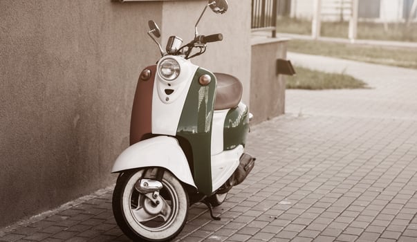 Vintage scooter in city street photo