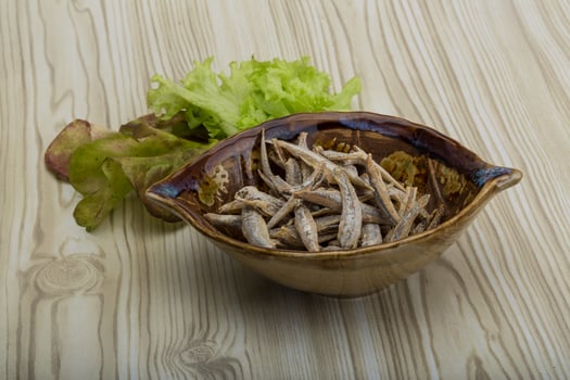 Dries anchovy on wood photo
