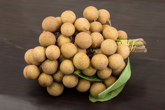 Longan on wooden background photo