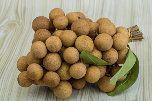Longan on wooden background photo