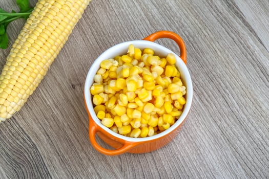 Sweet corn on wood photo