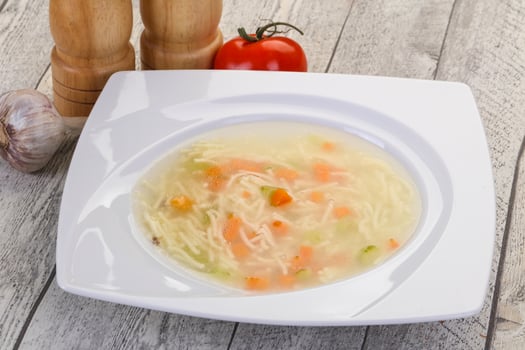 Chicken soup with noodles photo