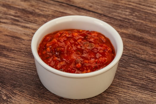 Tomato spicy sauce in the bowl photo