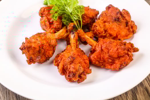 Chicken lollipops on wood photo