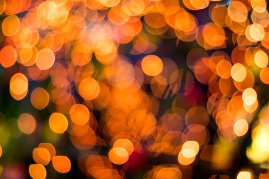 Bokeh blurred lights orange round lot. photo