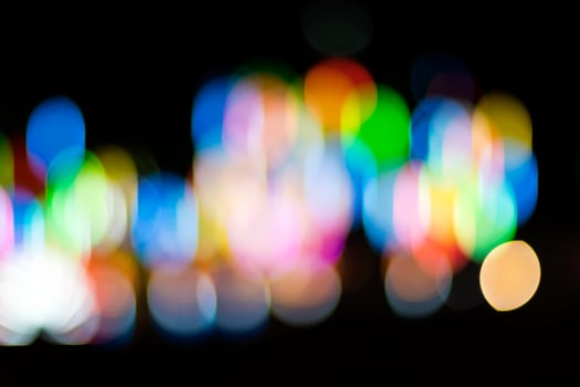 Abstract blurred bokeh, lots of colorful lights in the dark. photo