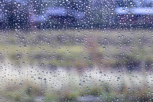 Rain drops on windshield with rural. photo
