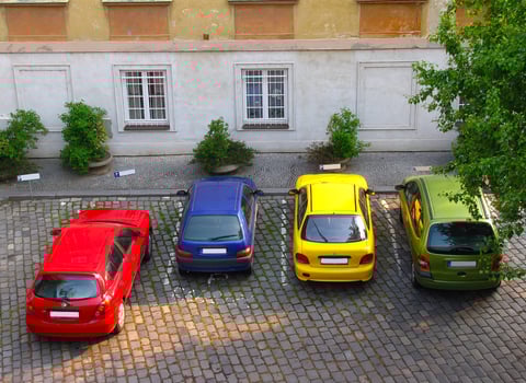 Colorful cars parked together on the parking area photo