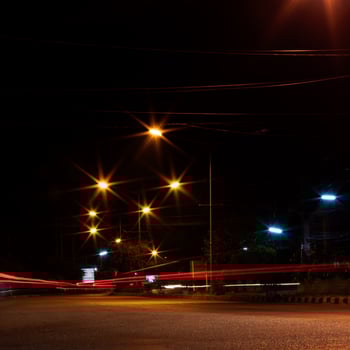 Car headlights and night street lamps. photo