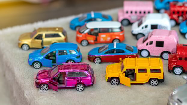 Model toys, large yellow and purple sedan cars. photo