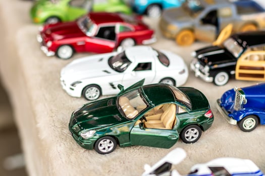 Classic green two-door coupe model toy. photo