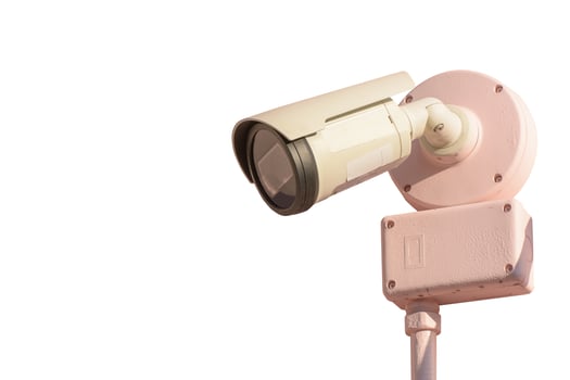 CCTV camera mounted on a white background. photo