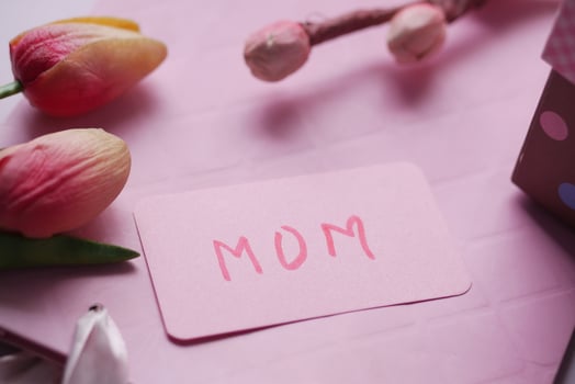 f mother day gift and flower on table. photo