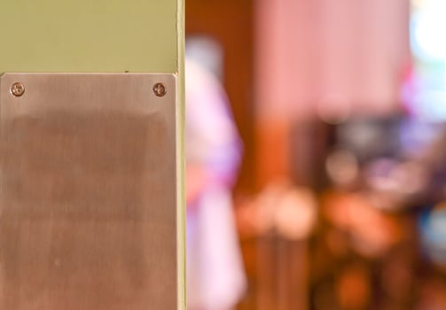 Restaurant wooden door with metal plate. Selective focus. With copy space. photo