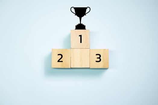 Top view trophy on top of wooden blocks  set  to podium. Concept for success and teamwork. photo