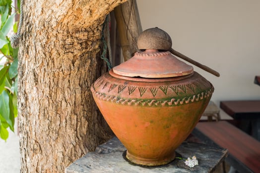 Eastern water jar in the garden photo