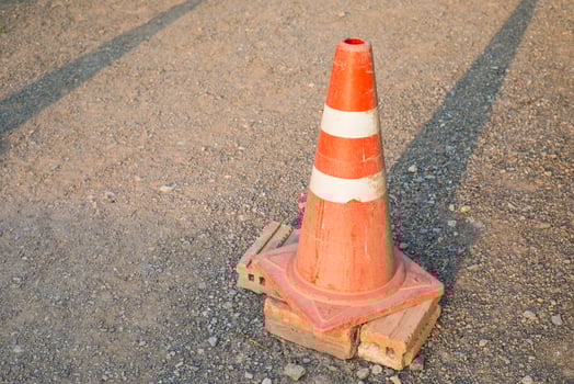 The old traffic cone on the road photo