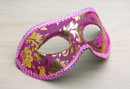 Carnival mask on wooden background photo