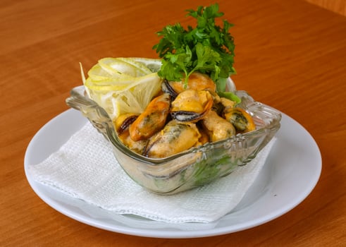 Mussels in butter sauce photo