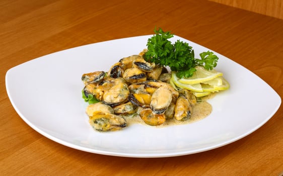 Mussels in butter sauce photo