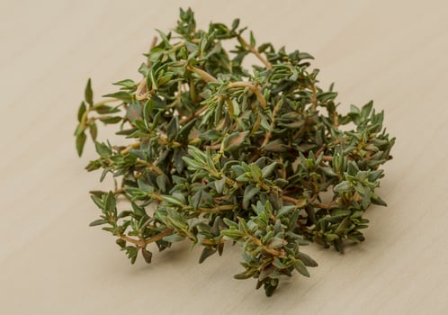 Thyme on wooden background photo