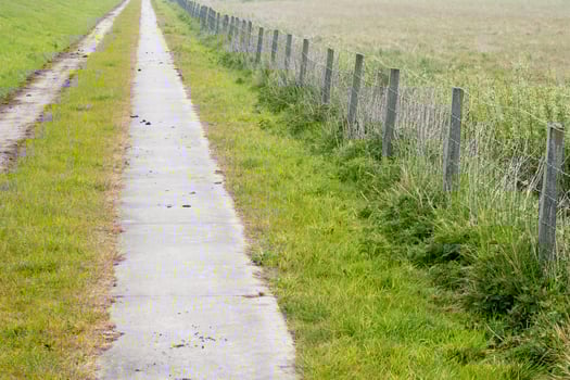 small street with fence photo