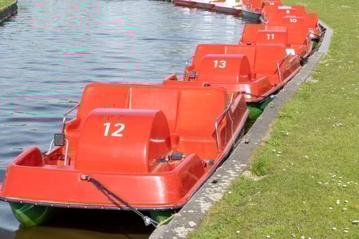 red boats on a river photo