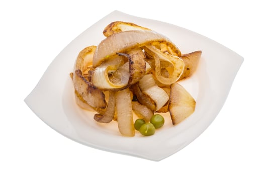 Fried onion on the plate and white background photo