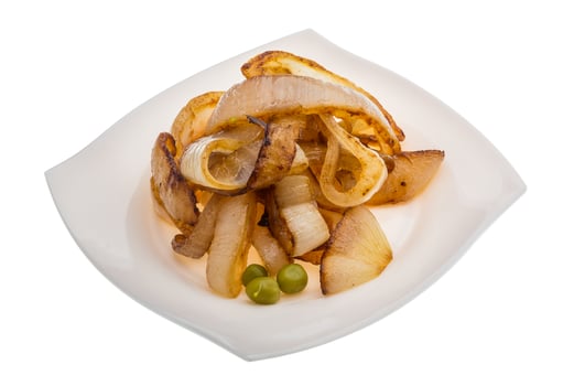 Fried onion on the plate and white background photo