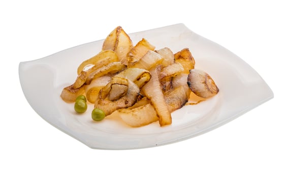 Fried onion on the plate and white background photo