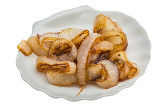 Fried onion on the plate and white background photo