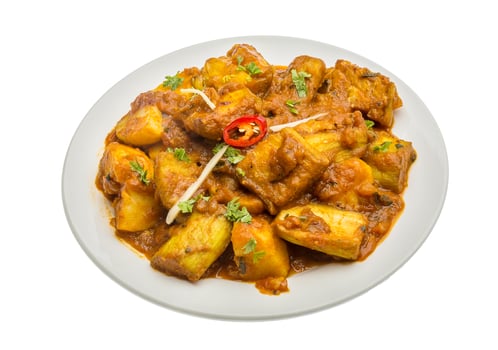 Alu Bengan on the plate and white background photo