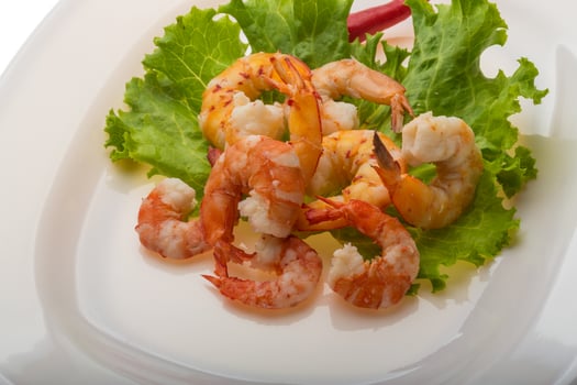 Unshelled king prawn on the plate photo